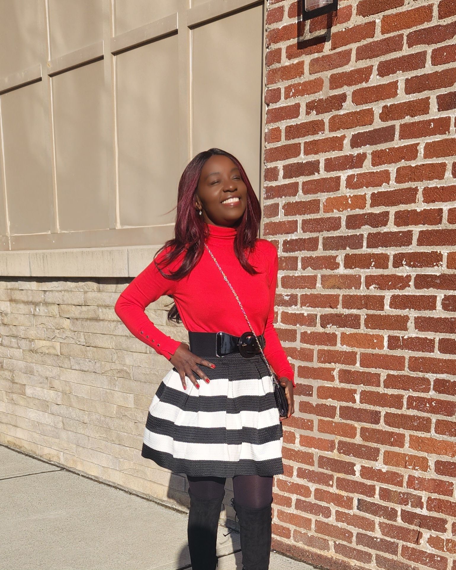 How to Rock a Striped Mini Skirt with Thigh-High Boots