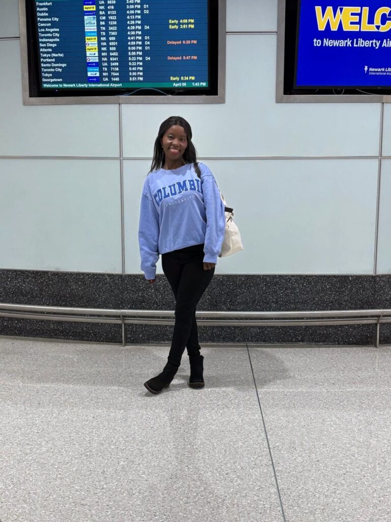 New Jersey traveler at the airport getting ready to fly to Miami for a South Beach pre-cruise vacation in April
