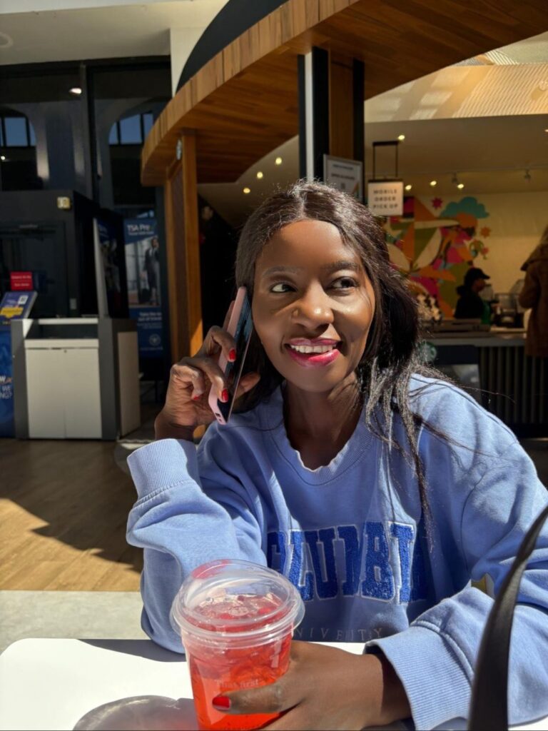 Sipping a Starbucks Strawberry Acai Refresher at the airport while getting ready to travel to South Beach for a cruise vacation